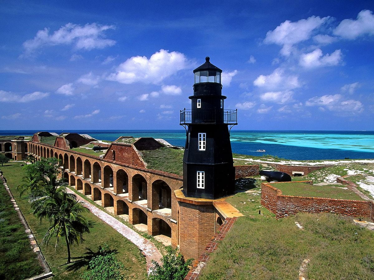 Castle with clock tower next to sea (Fort Jefferson, Florida, United States of America)