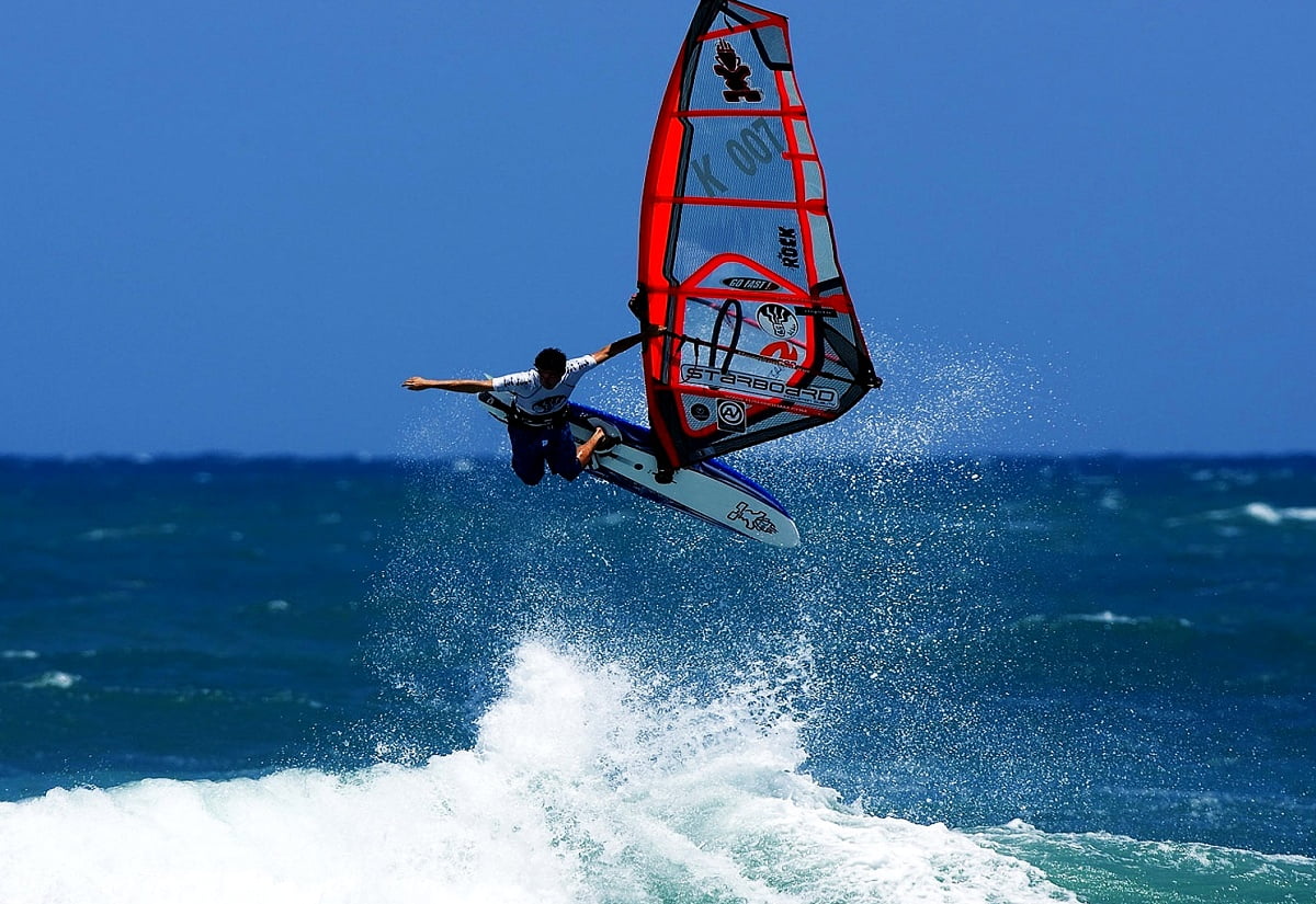 Complete the exchanges he is on windsurfing